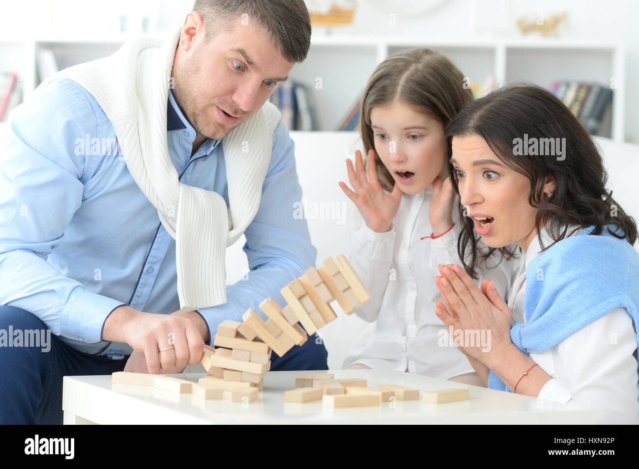 Family with daughter playing a game Stock Photo