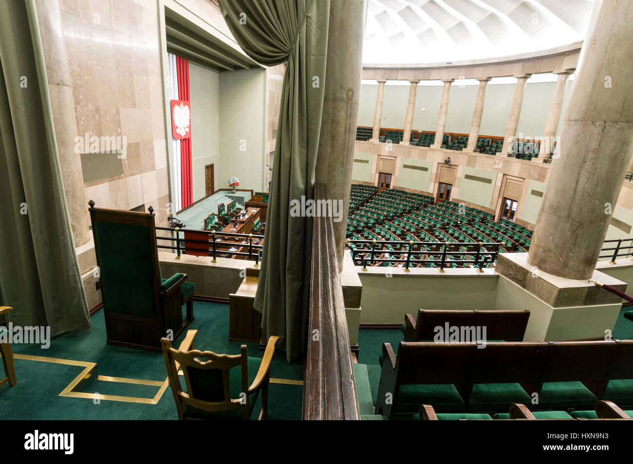 The Polish Sejim Debate Hall  of the Polish Parliament in Warsaw, Poland.  The single chair on the left is where the Polish President sits during deba Stock Photo