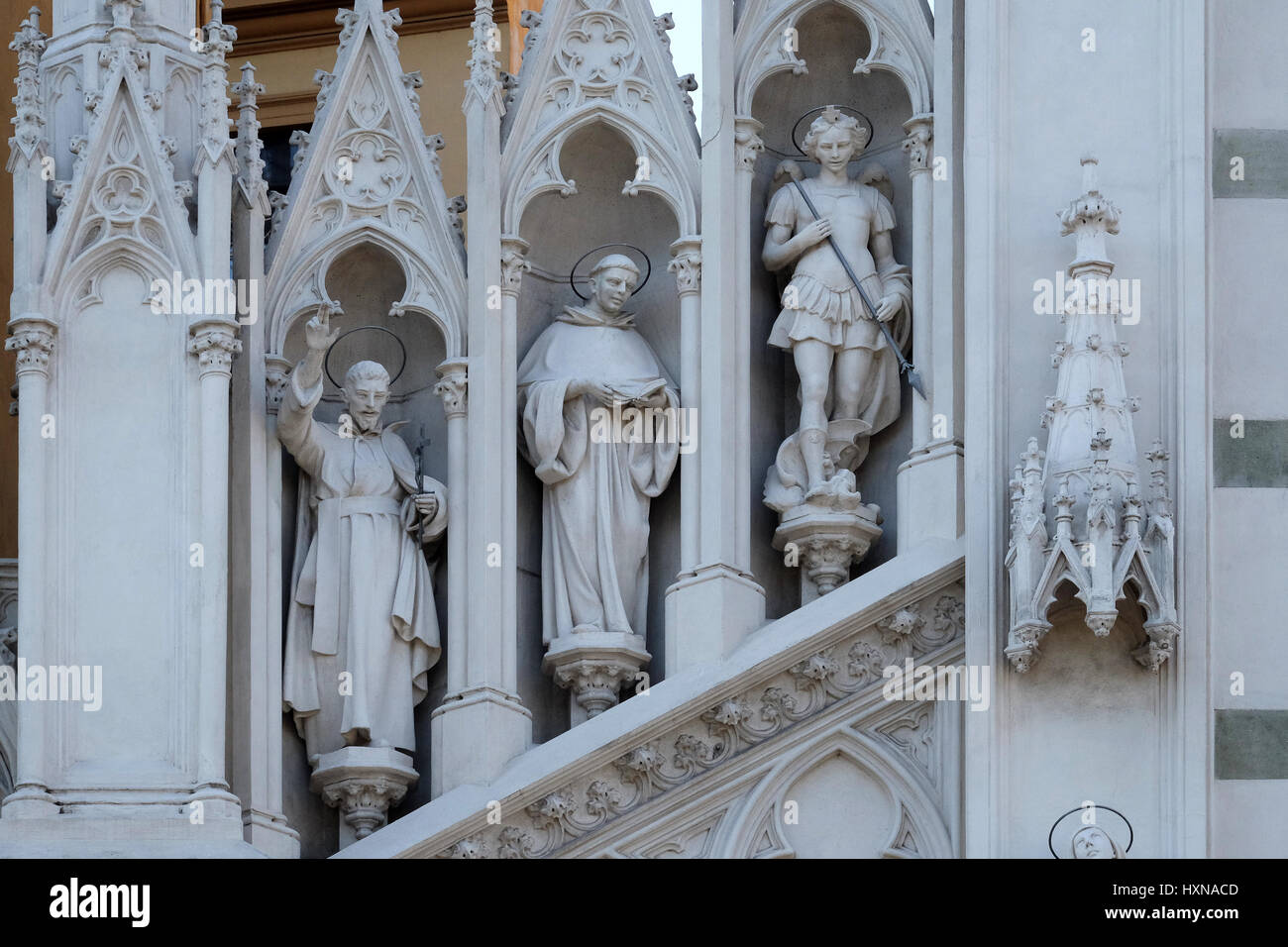 Statues of St. Francis Xavier, Dominic of Guzman and Michael Archangel on the facade of Sacro Cuore del Suffragio church i Stock Photo