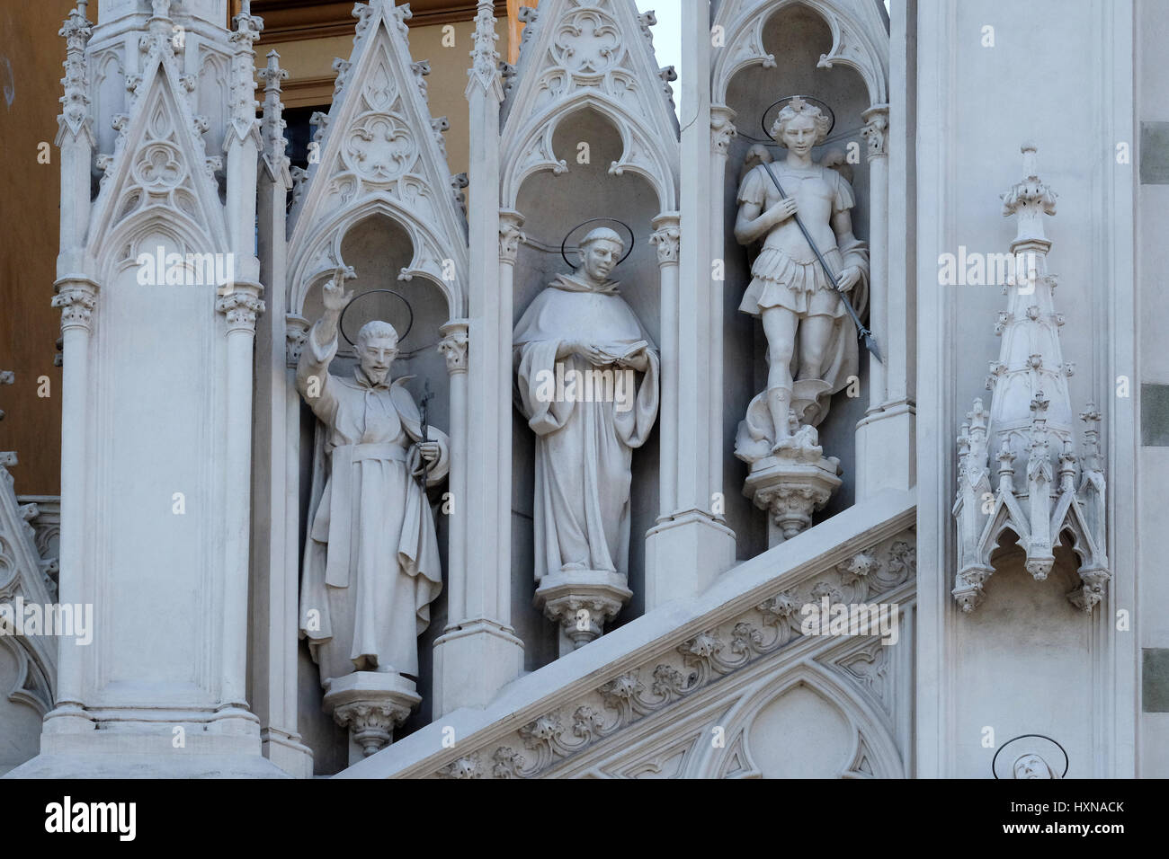 Statues of St. Francis Xavier, Dominic of Guzman and Michael Archangel on the facade of Sacro Cuore del Suffragio church i Stock Photo