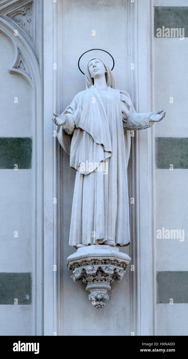 Statue of St. Margaret Mary Alacoque on the facade of Sacro Cuore del