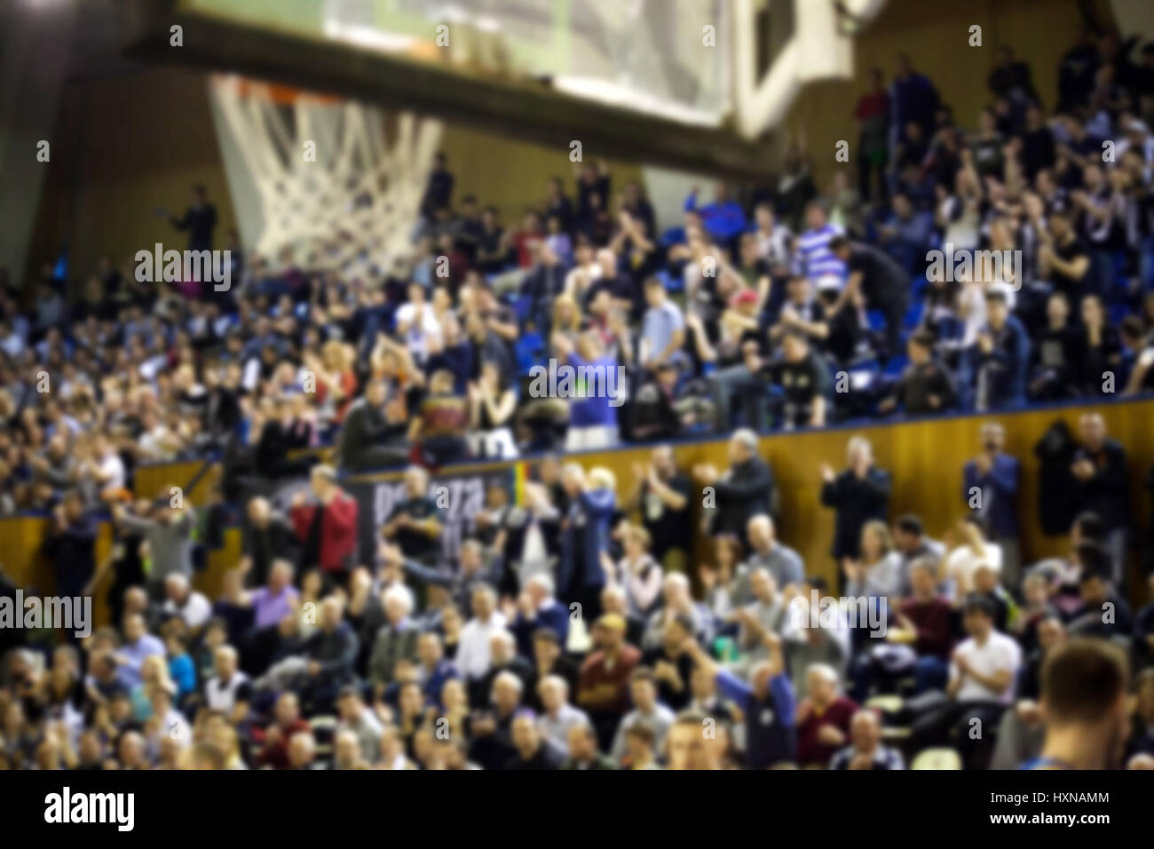 blurred basketball crowd watching game in arena Stock Photo