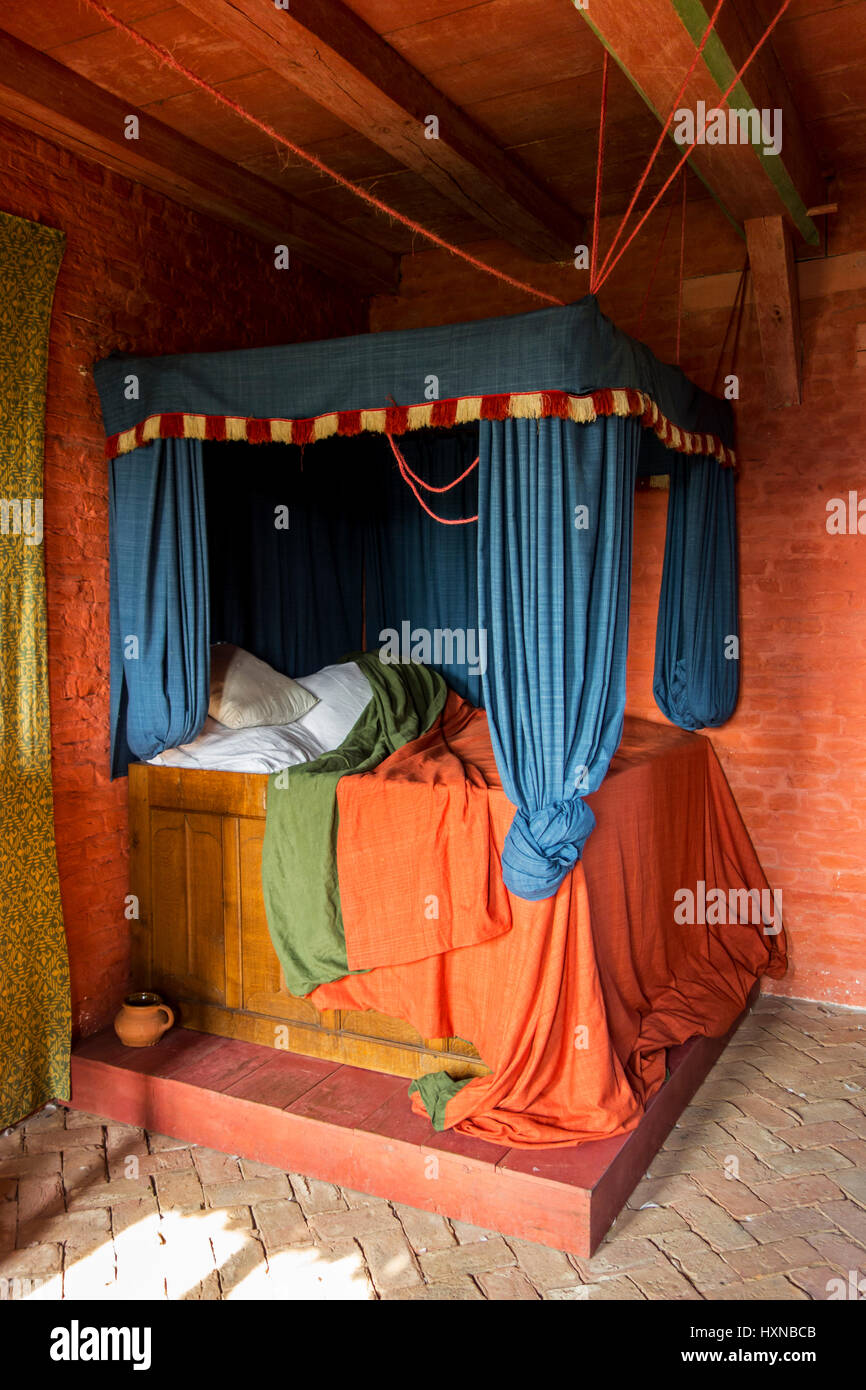 Colourful medieval curtained bedstead / bed with curtains in bedroom from  the Middle Ages Stock Photo - Alamy