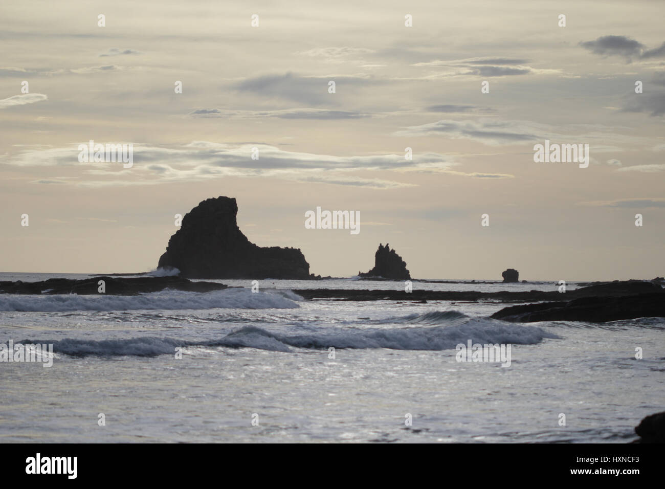 Inside Ocean Rocks Rocks and cliffs inside the ocean at sunset Stock Photo - Alamy