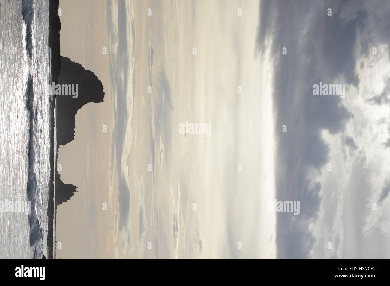 Inside Ocean Rocks Rocks and cliffs inside the ocean at sunset Stock Photo - Alamy