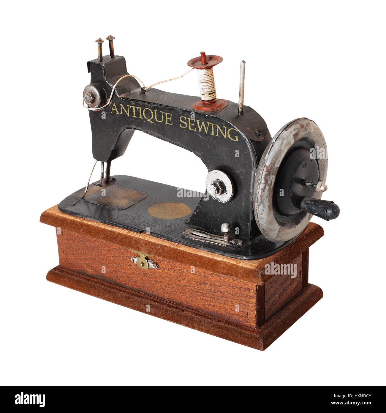 The image of the antique sewing machine isolated on a white background ...