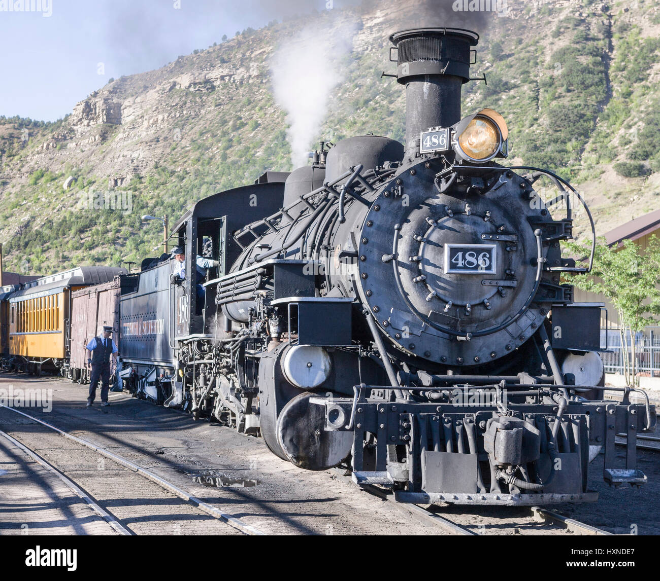 Durango, CO, USA - 21 August 2008: Engineer & Conductor readying Durango & Silverton Narrow Gauge Railroad steam locomotive and train for departure Stock Photo