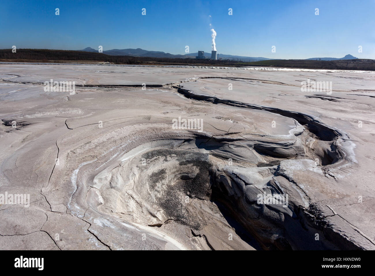 Sediment bowls. A byproduct of coal mining is pollution nature and landscape. In the background Ledvice power plant, Czech Republic, Europe Stock Photo
