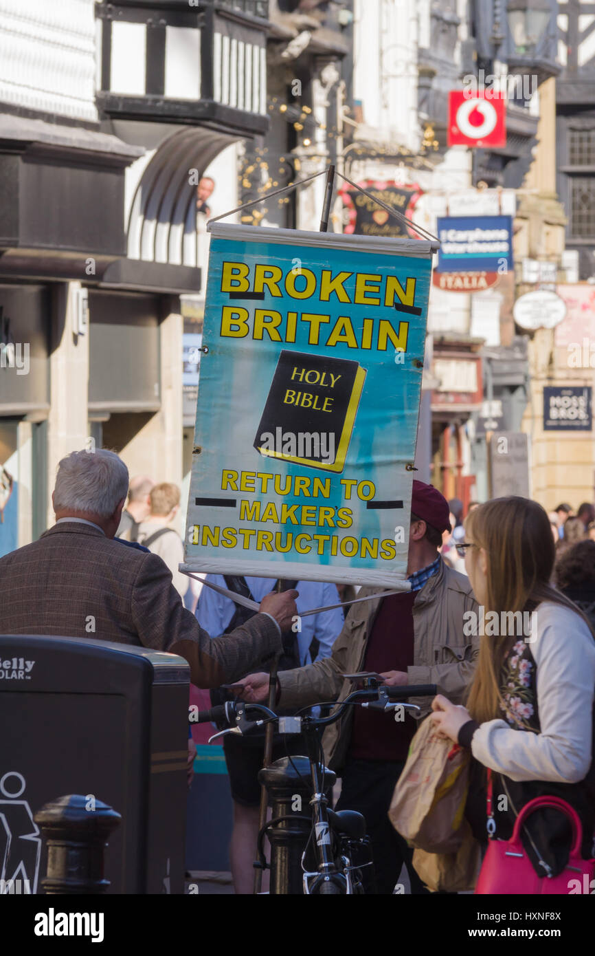 Evangelist Christian street preacher holds his banner proclaiming Broken Britain in Chester UK Stock Photo