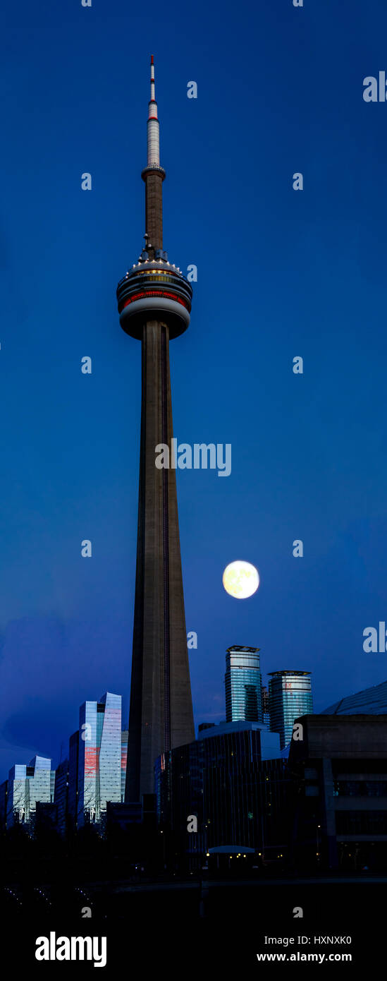 CN Tower with a full moon at night - Toronto, Ontario, Canada Stock Photo