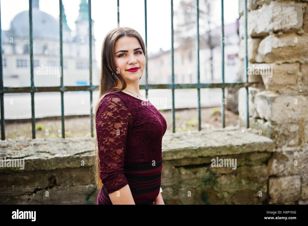 Young chubby teenage girl wear on red dress and jeans jacket posed against  school backyard Stock Photo - Alamy