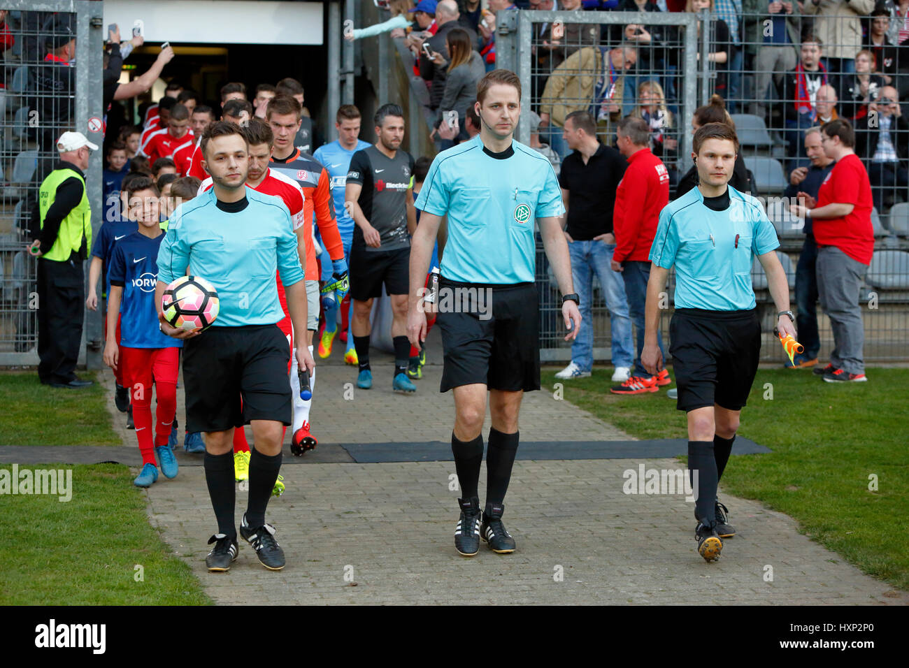 sports, football, Lower Rhine Cup, 2016/2017, semifinal, Wuppertaler SV vs Rot Weiss Essen 2:3, Stadium Am Zoo in Wuppertal, teams running in, match officials f.l.t.r. assistant Jens Laux, referee Dr. Martin Thomsen, assistant Alexander Busse Stock Photo