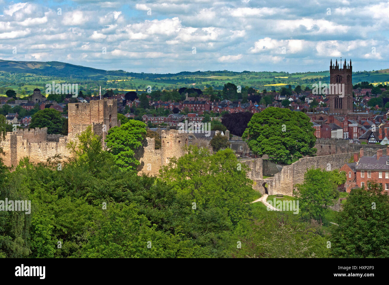 View across the rural Shropshire town of Ludlow, showing both the castle and the church of St Laurence Stock Photo