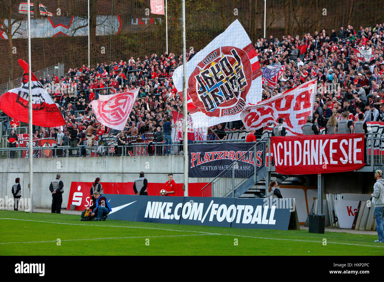 sports, football, Lower Rhine Cup, 2016/2017, semifinal, Wuppertaler SV vs Rot Weiss Essen 2:3, Stadium Am Zoo in Wuppertal, stadium view, stand, stands, visitors, spectators, football fans of Essen, flags, banner 'Ich Danke Sie' as a memento to the former RWE player Willi 'Ente' Lippens Stock Photo