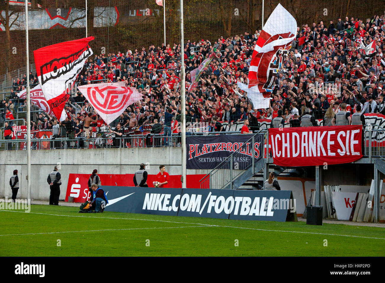 sports, football, Lower Rhine Cup, 2016/2017, semifinal, Wuppertaler SV vs Rot Weiss Essen 2:3, Stadium Am Zoo in Wuppertal, stadium view, stand, stands, visitors, spectators, football fans of Essen, flags, banner 'Ich Danke Sie' as a memento to the former RWE player Willi 'Ente' Lippens Stock Photo