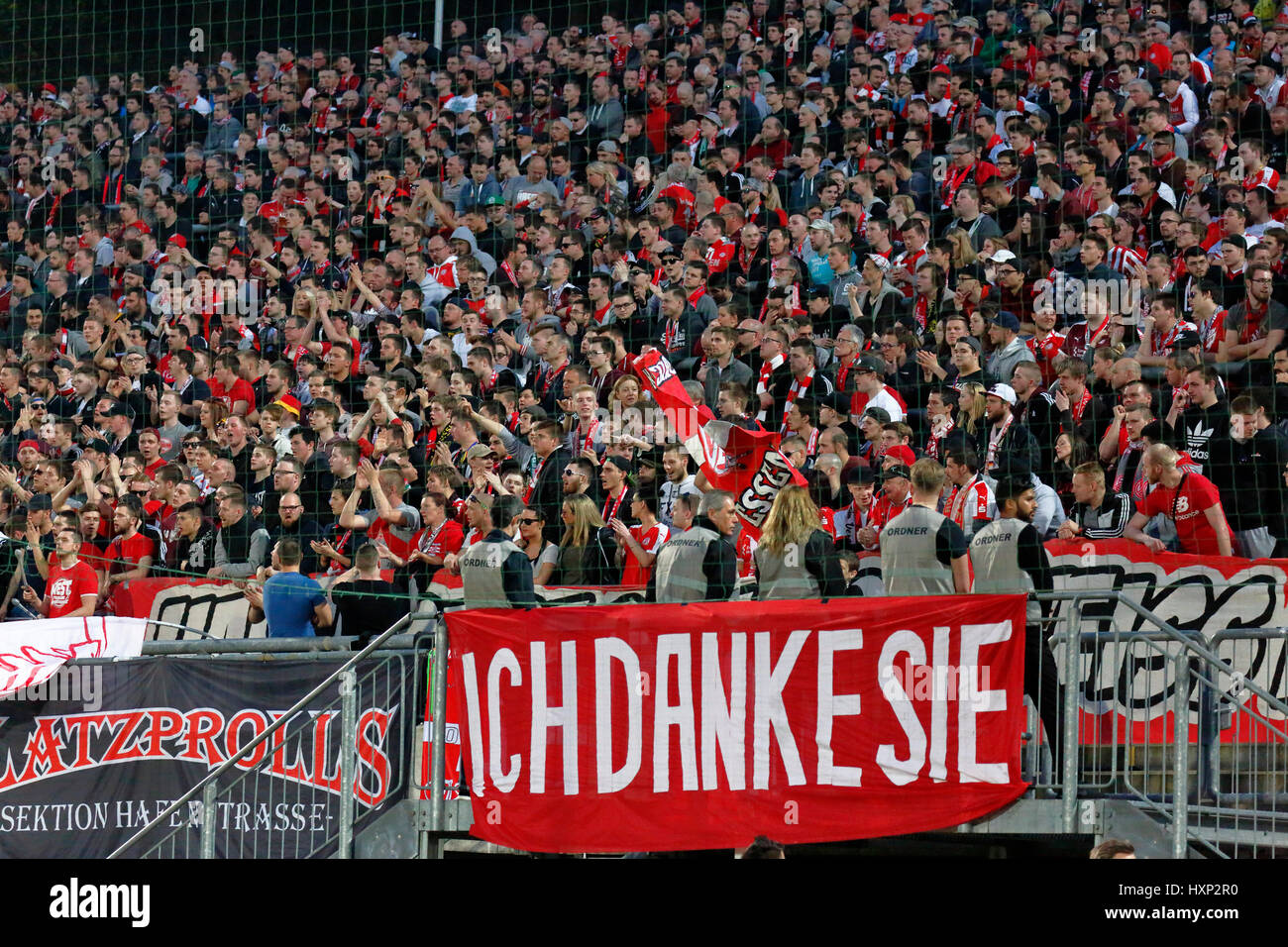 sports, football, Lower Rhine Cup, 2016/2017, semifinal, Wuppertaler SV vs Rot Weiss Essen 2:3, Stadium Am Zoo in Wuppertal, stadium view, stand, stands, visitors, spectators, football fans of Essen, banner 'Ich Danke Sie' as a memento to the former RWE player Willi 'Ente' Lippens Stock Photo