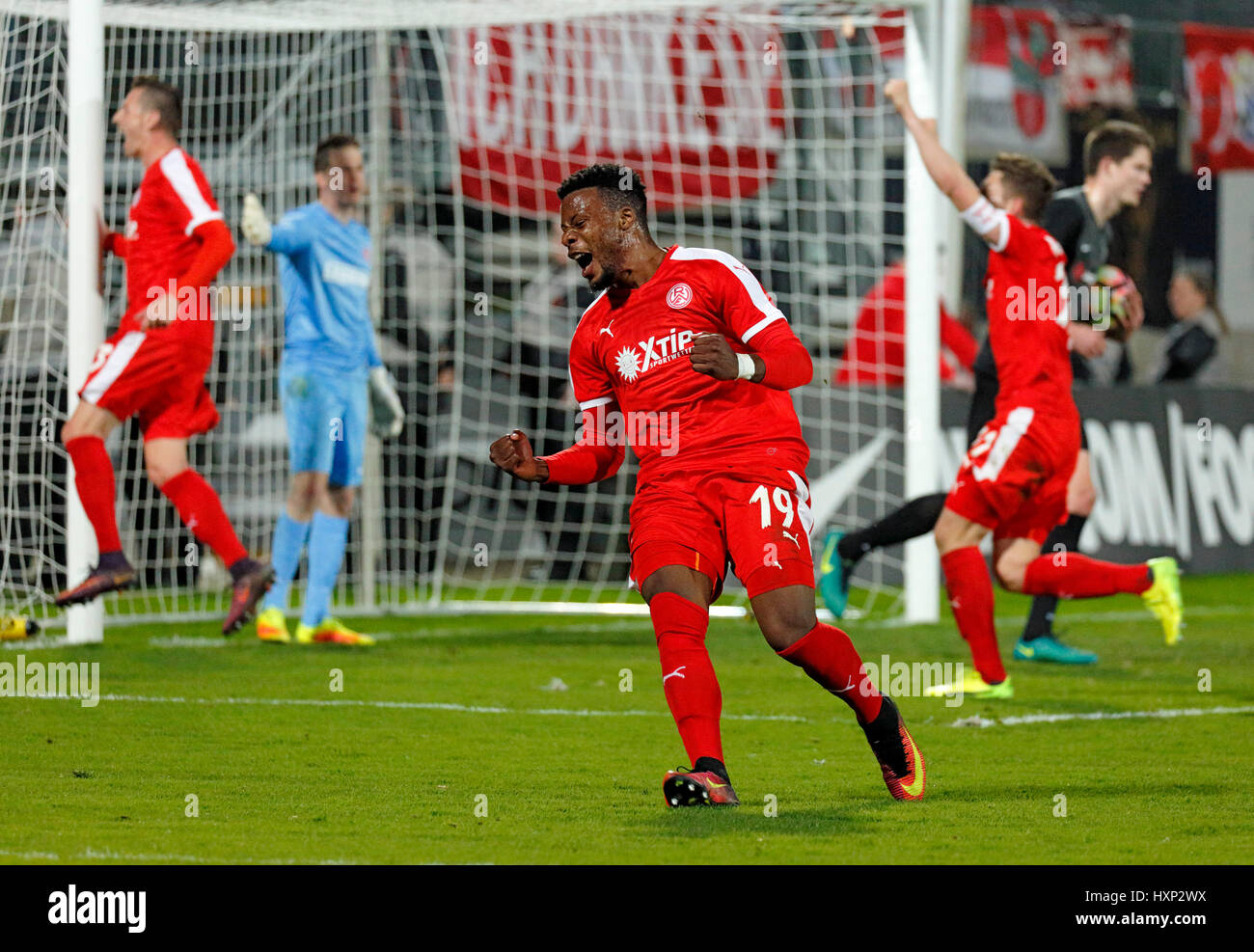 sports, football, Lower Rhine Cup, 2016/2017, semifinal, Wuppertaler SV vs Rot Weiss Essen 2:3, Stadium Am Zoo in Wuppertal, Roussel Ngankam Hontcheu (RWE) rejoicing at the 1:2 goal to Essen by goal scorer Timo Brauer (not pictured) Stock Photo