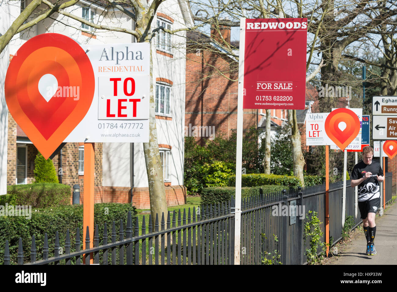 Estate agent signs outside flats, London Road, Englefield Green, Surrey, England, United Kingdom Stock Photo