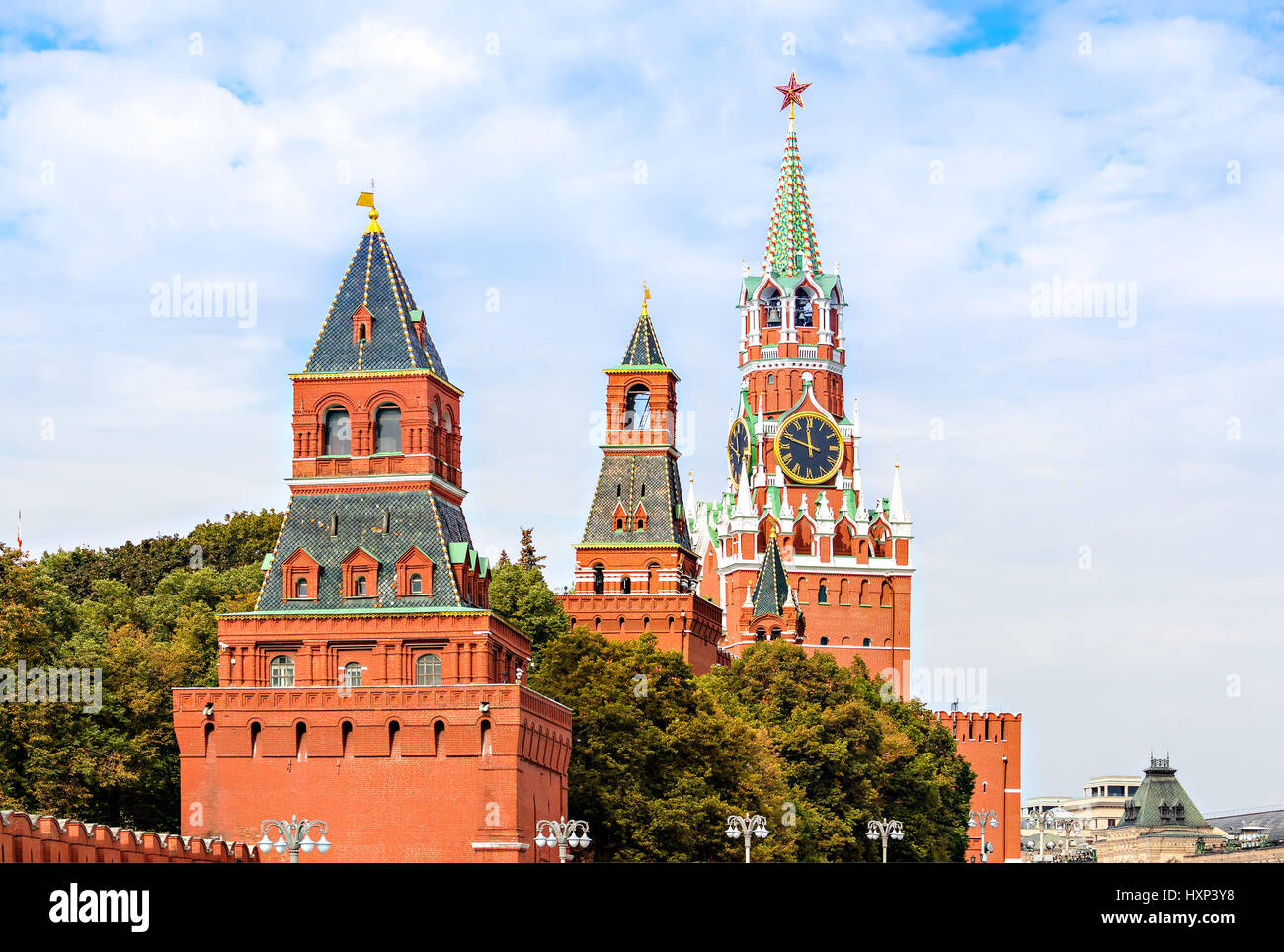 Kremlin wall towers with Spasskaya (Saviour) Tower on the background in Moscow, Russia Stock Photo
