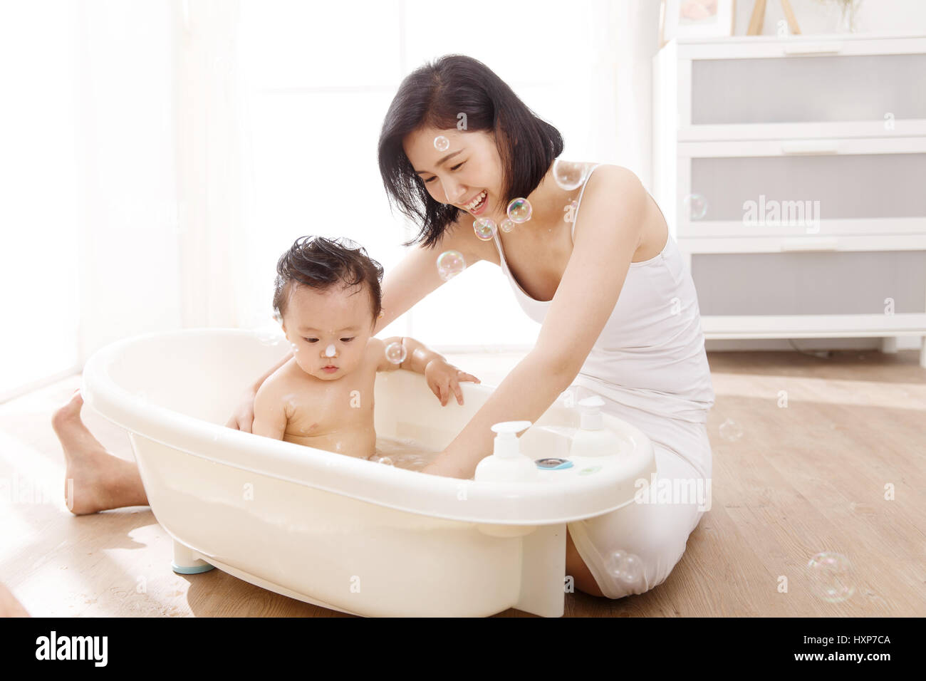 Mommy take. Son Bath. Mom taking a Bath. Mother Bath. Alamy stock Bath time.