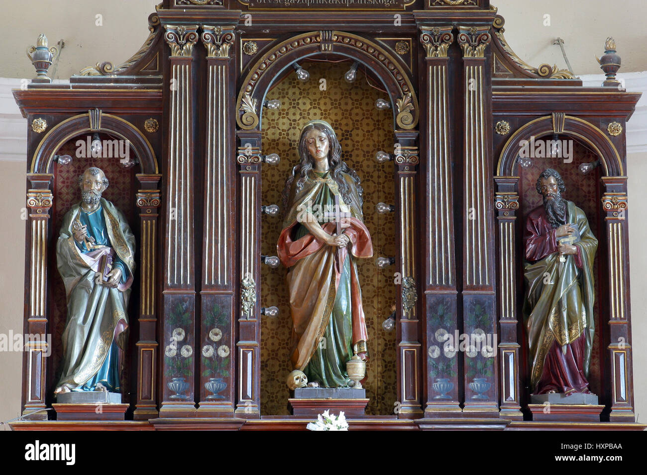 Saint Peter, Saint Mary Magdalene and Saint Paul, altar in Parish Church of Saint Mary Magdalene in Donja Kupcina, Croatia Stock Photo
