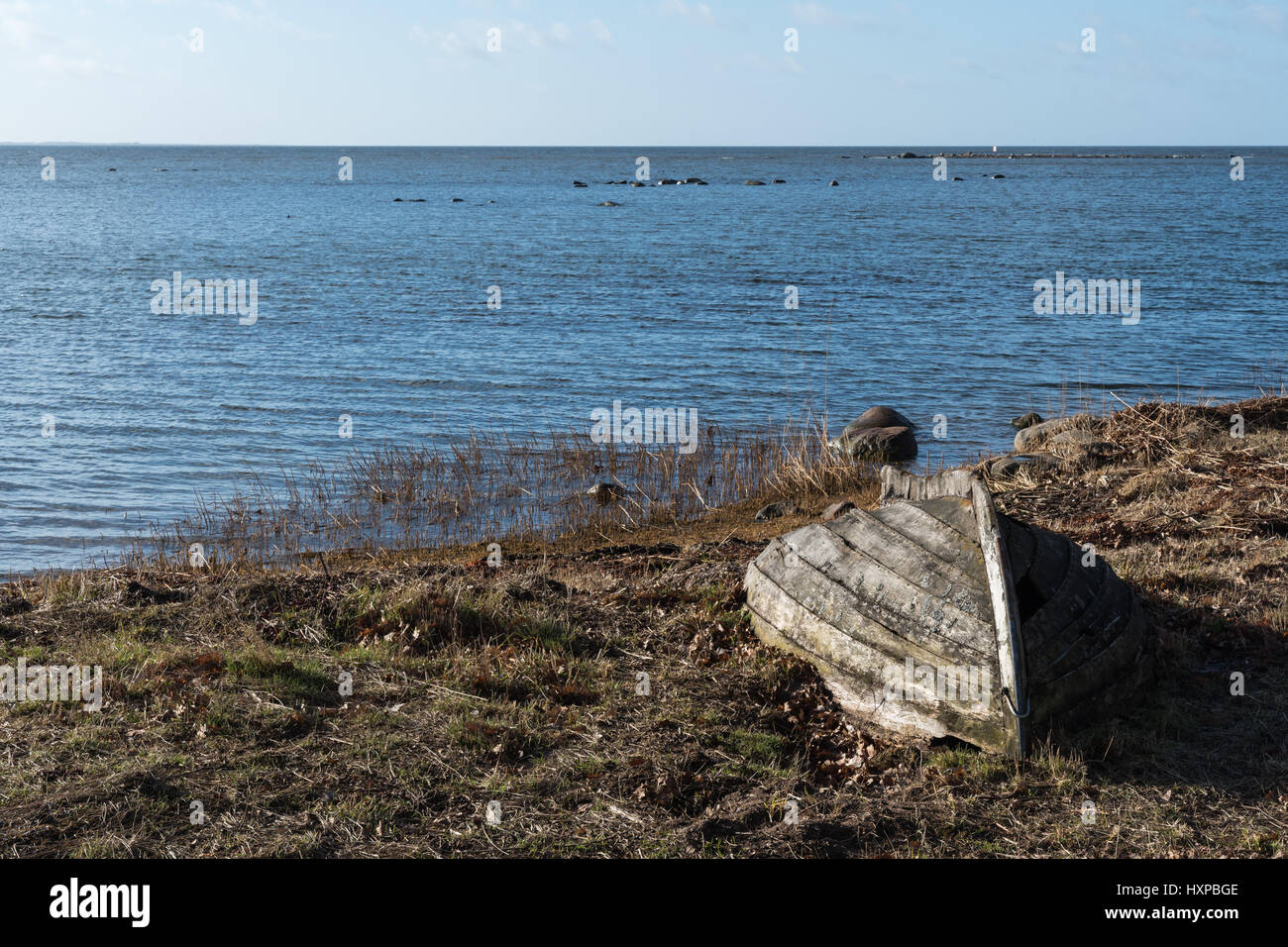 Abandoned old wooden rowing boat by the coast at spring season Stock ...