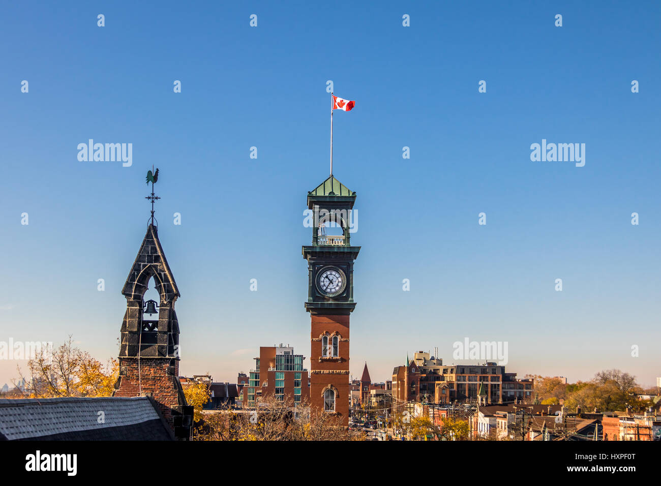 Church and Clocktower with Canadian Flag - Toronto, Ontario, Canada Stock Photo