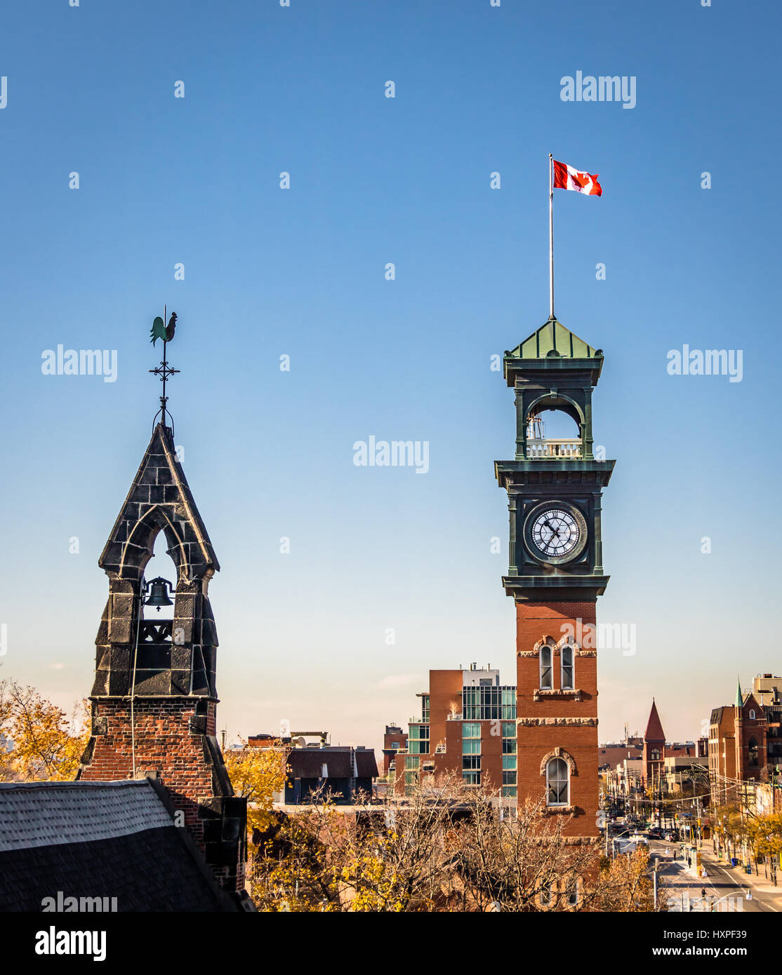 Church and Clocktower with Canadian Flag - Toronto, Ontario, Canada Stock Photo