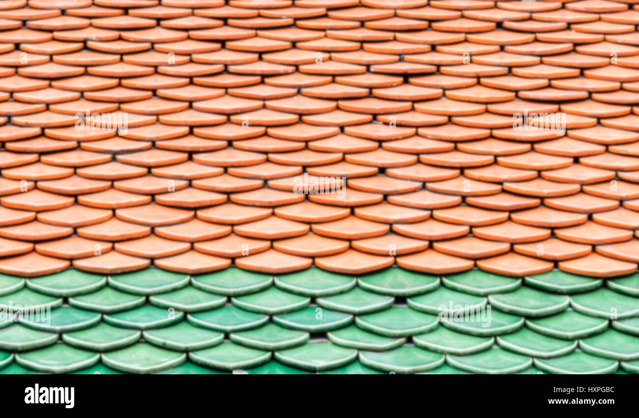 Ceramic tiles roof with the layer pattern of the Thai church.(Blur ... Ceramic tiles roof with the layer pattern of the Thai church.(Blur ...