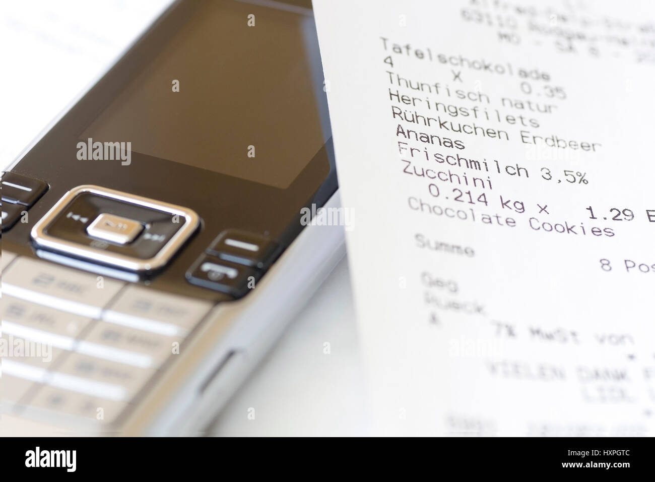 Mobile phone with receipt (no Pr), Handy mit Kassenbon (no pr) Stock Photo
