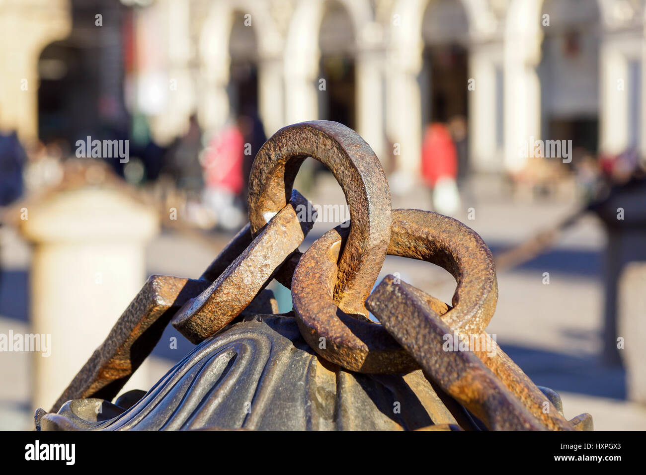 Metal chain with big ring. Close up texture of rocky surface with iron chain and ring on it Stock Photo