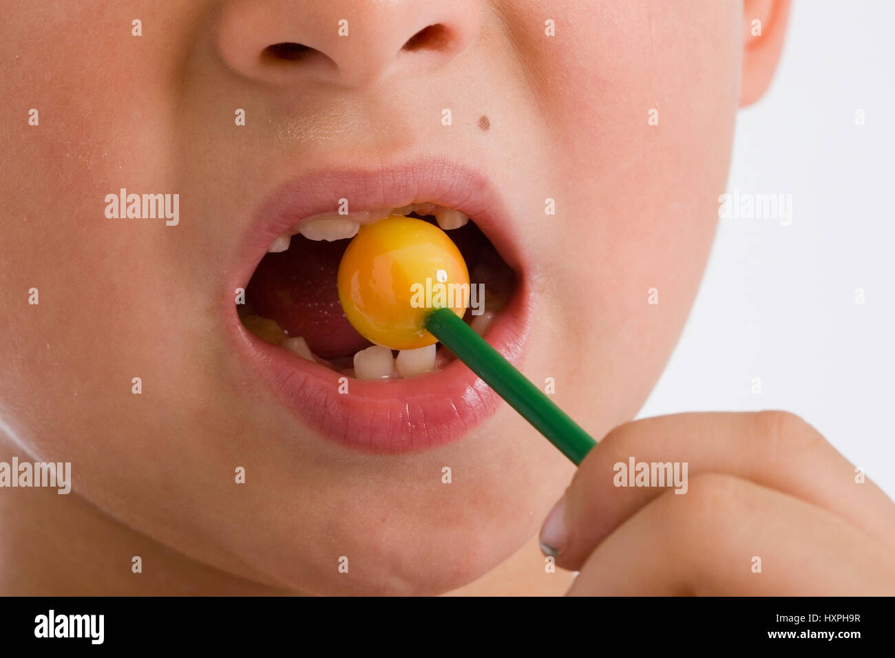 6-year-old boy with lollipop (released), sechsjähriger Junge mit Lutscher (modell released) Stock Photo