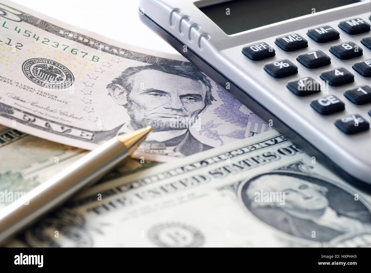 The US dollar beside a pocket calculator (no Pr), US Dollar neben einem  Taschenrechner (no pr Stock Photo - Alamy
