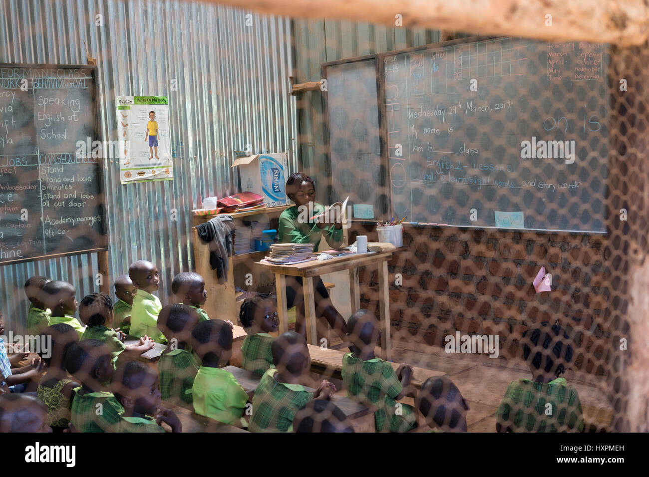 A teacher and her pupils at a Bridge International Academies primary school in Mpigi, Uganda. Stock Photo