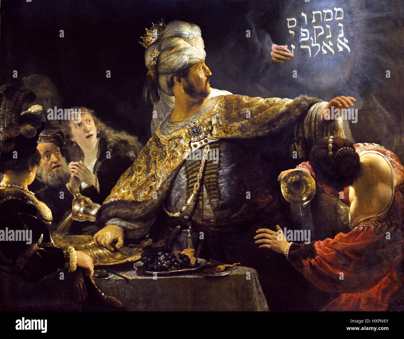 Belshazzar's Feast about 1636-8 Rembrandt Harmenszoon van Rijn1606–1669 Dutch The Netherlands (  According to the Book of Daniel, Belshazzar holds a last great feast at which he sees a hand writing on a wall with the Aramaic words mene, mene, tekel, upharsin, which Daniel interprets as a judgment from God foretelling the fall of Babylon. Stock Photo
