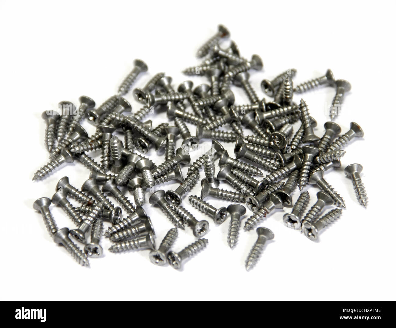 stack of black screws on white background Stock Photo - Alamy