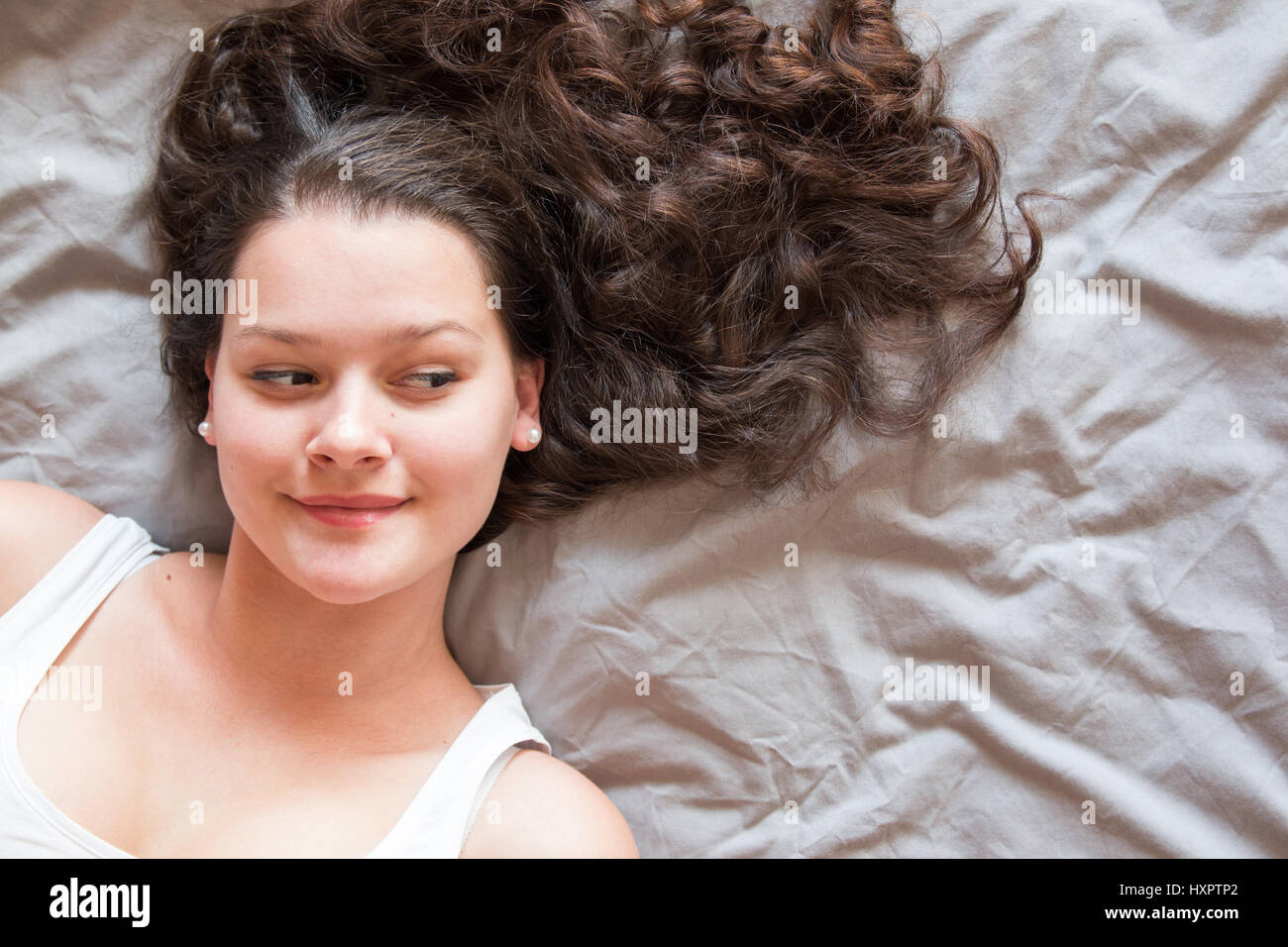 Charming woman Smile face close up and she lying on the bed, girl with