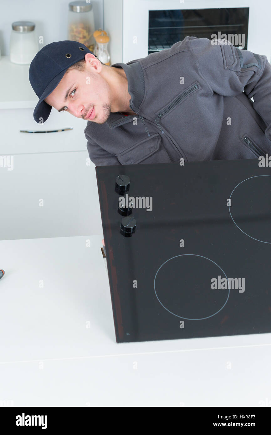 installing electrical hob Stock Photo Alamy