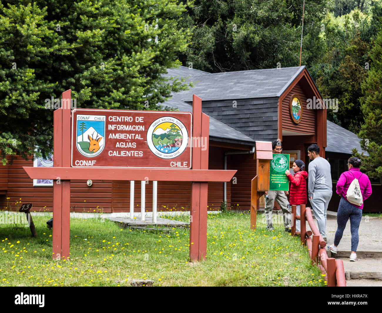 Tourists in front of park administration office, Conaf park ...