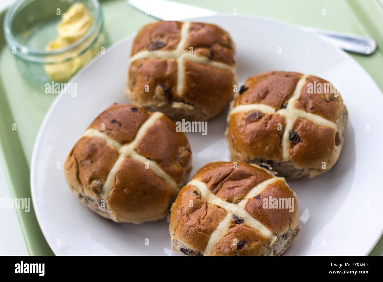 In 12th century an Anglican monk baked the buns and marked them with a cross in honor of Good Friday. they became a symbol of Easter weekend. Stock Photo