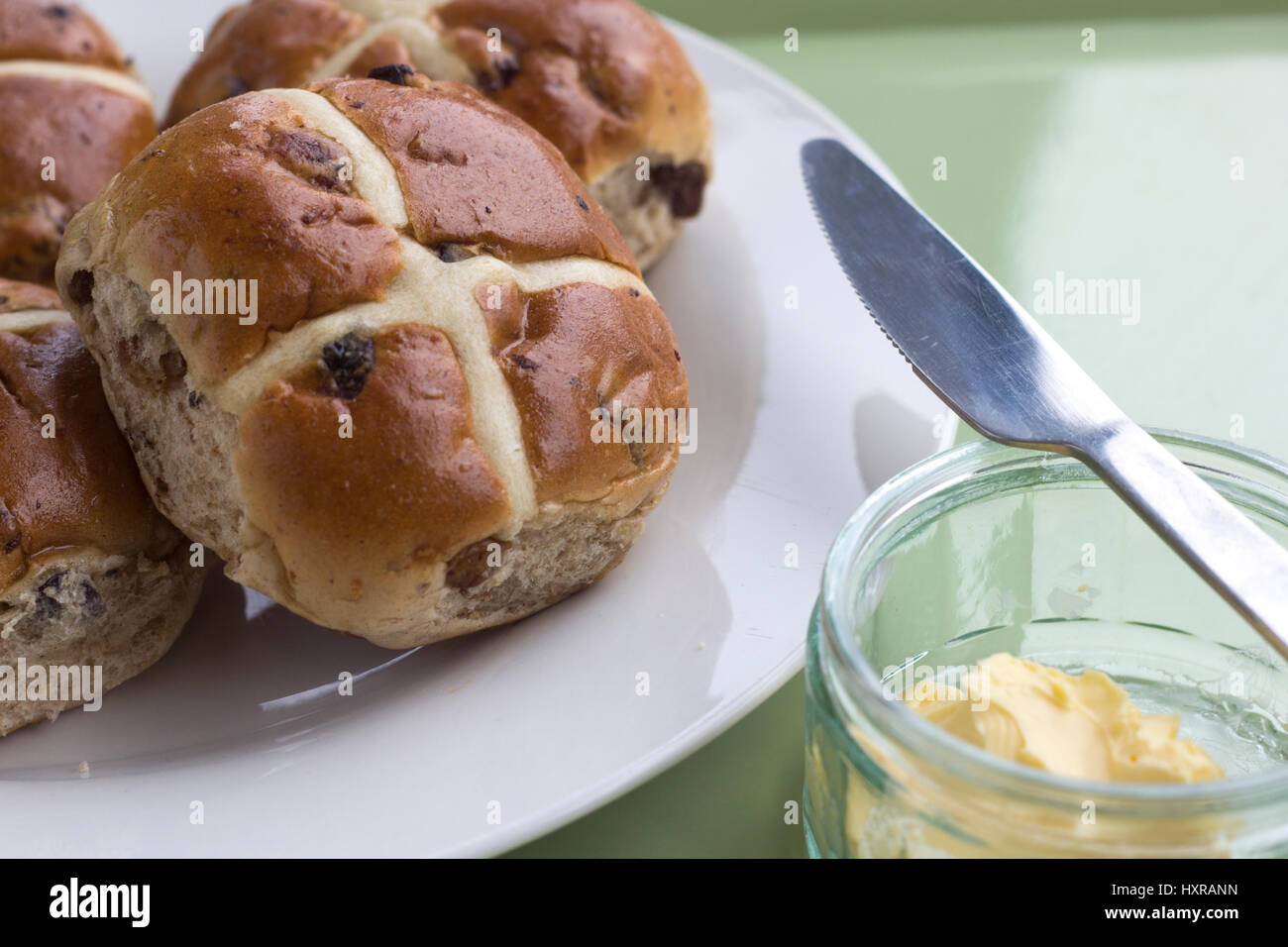 In 12th century an Anglican monk baked the buns and marked them with a cross in honor of Good Friday. they became a symbol of Easter weekend. Stock Photo