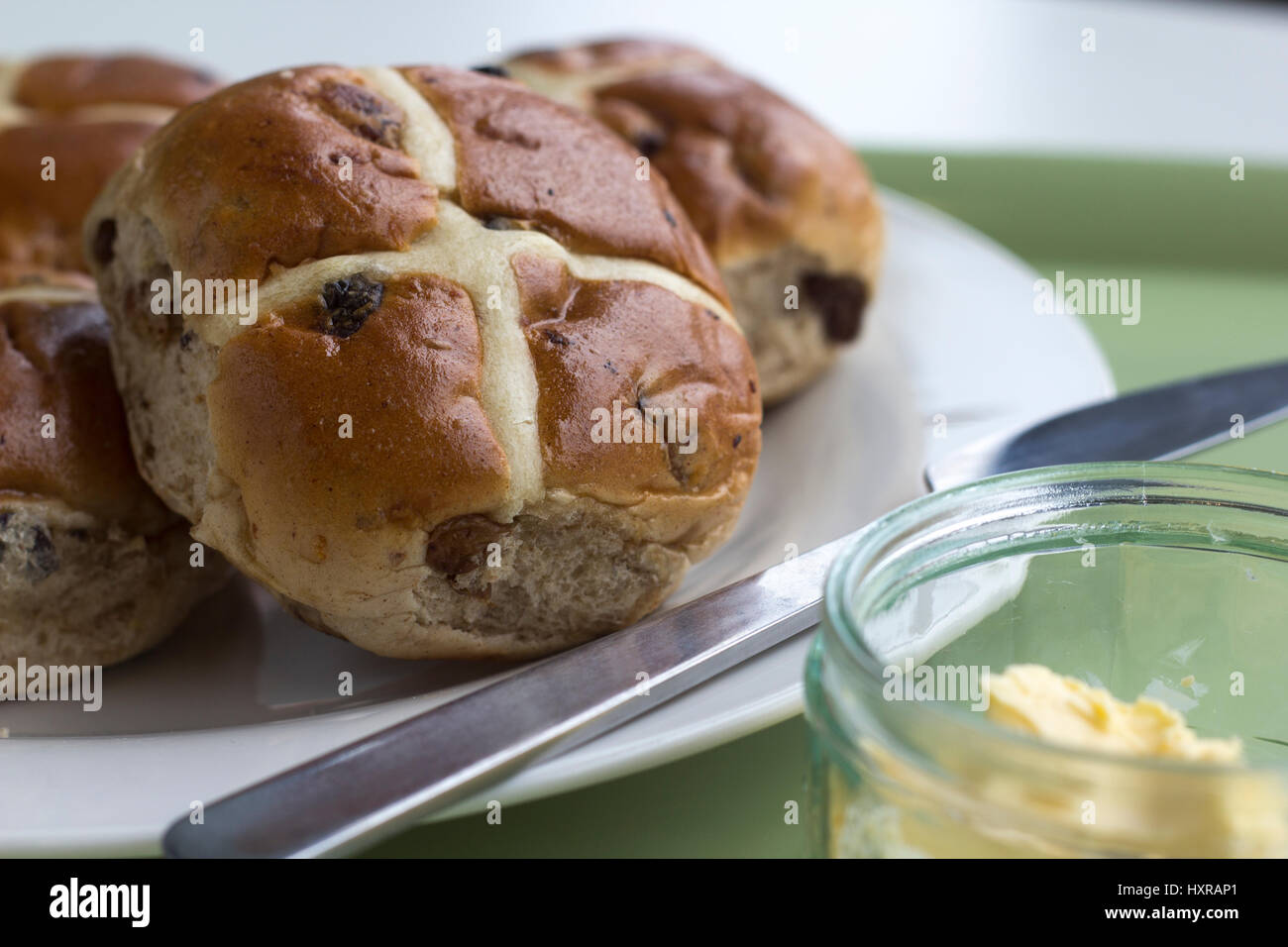 In 12th century an Anglican monk baked the buns and marked them with a cross in honor of Good Friday. they became a symbol of Easter weekend. Stock Photo