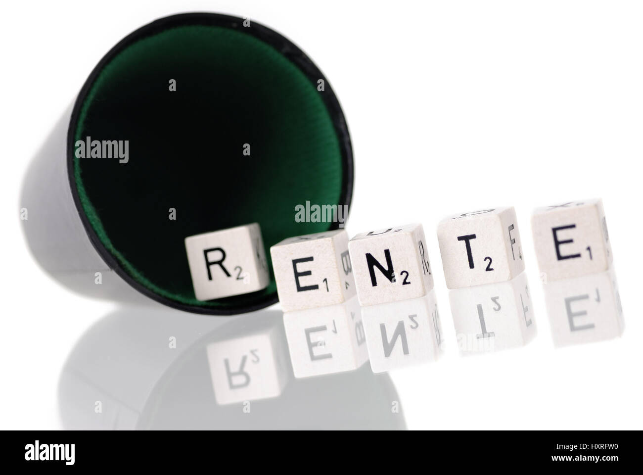 Dice cup with letter cube, stroke pension, Würfelbecher mit Buchstabenwürfel, Schriftzug Rente Stock Photo