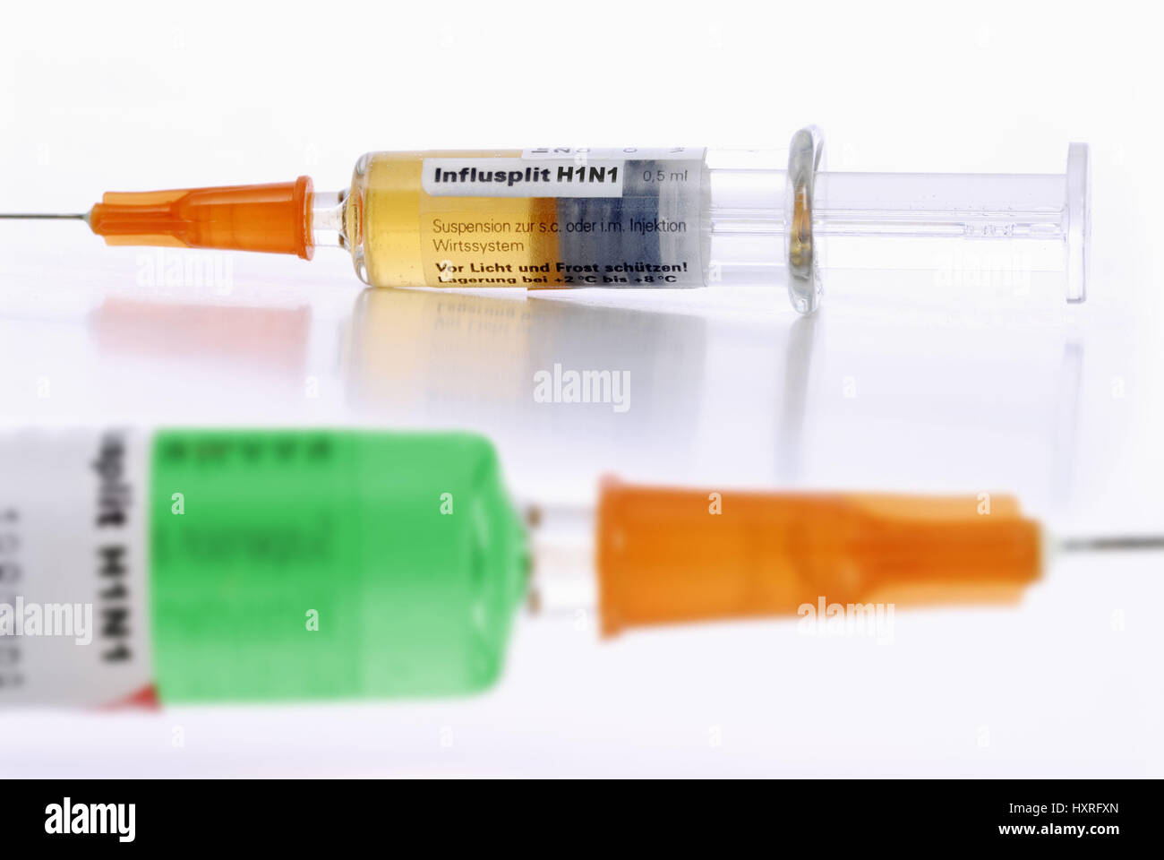 Different vaccines against the pork influenza in two syringes, Unterschiedliche Impfstoffe gegen die Schweinegrippe in zwei Spritzen Stock Photo