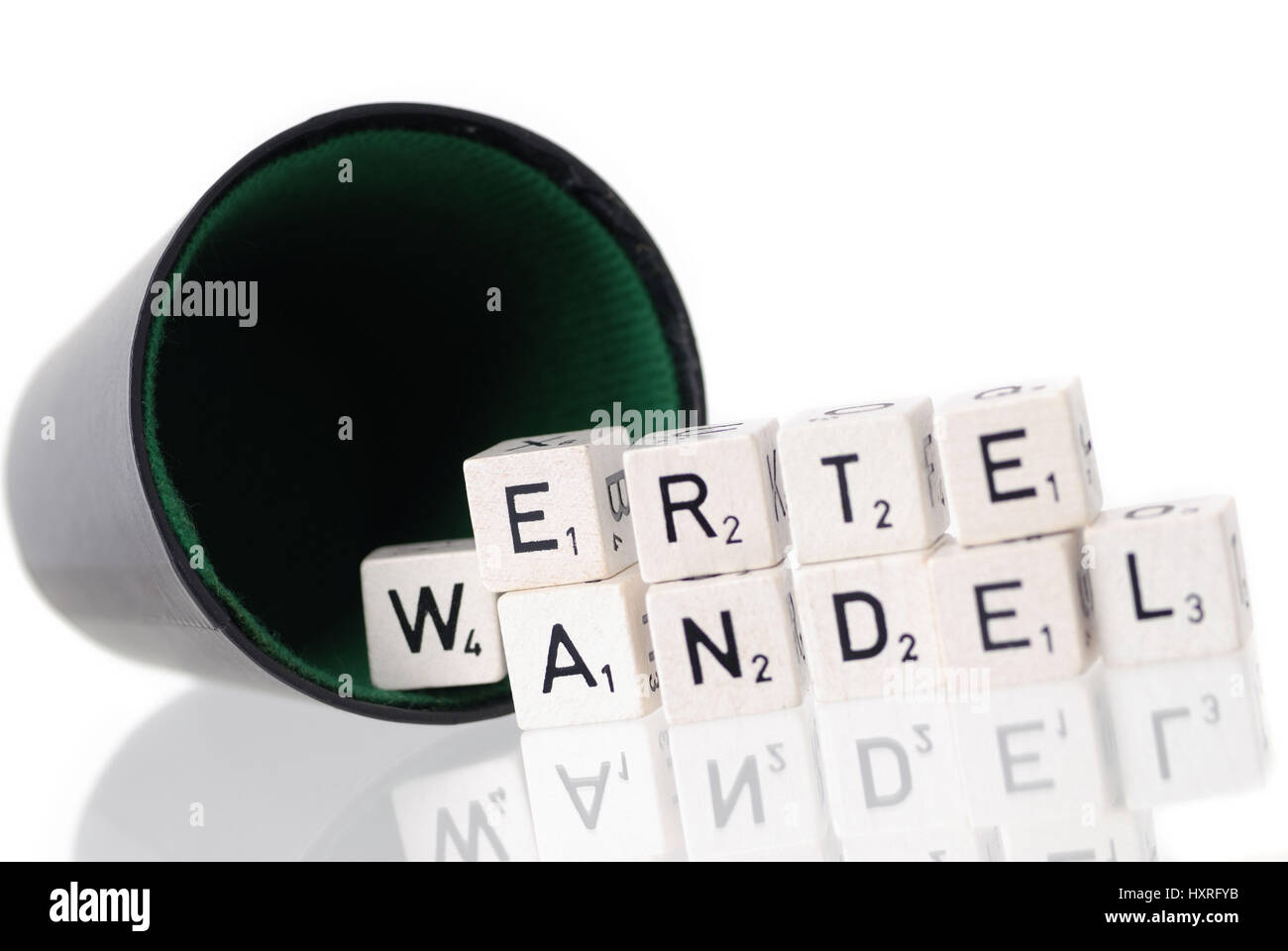 Dice cup with letter cube, stroke value change, Würfelbecher mit Buchstabenwürfel, Schriftzug Wertewandel Stock Photo