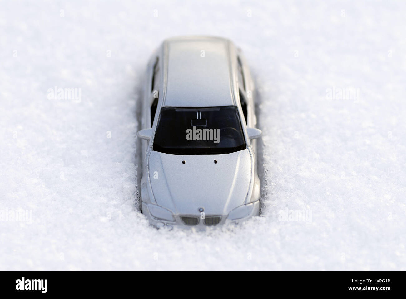 Miniature car in the snow submerged, Miniaturauto im Schnee versunken Stock Photo