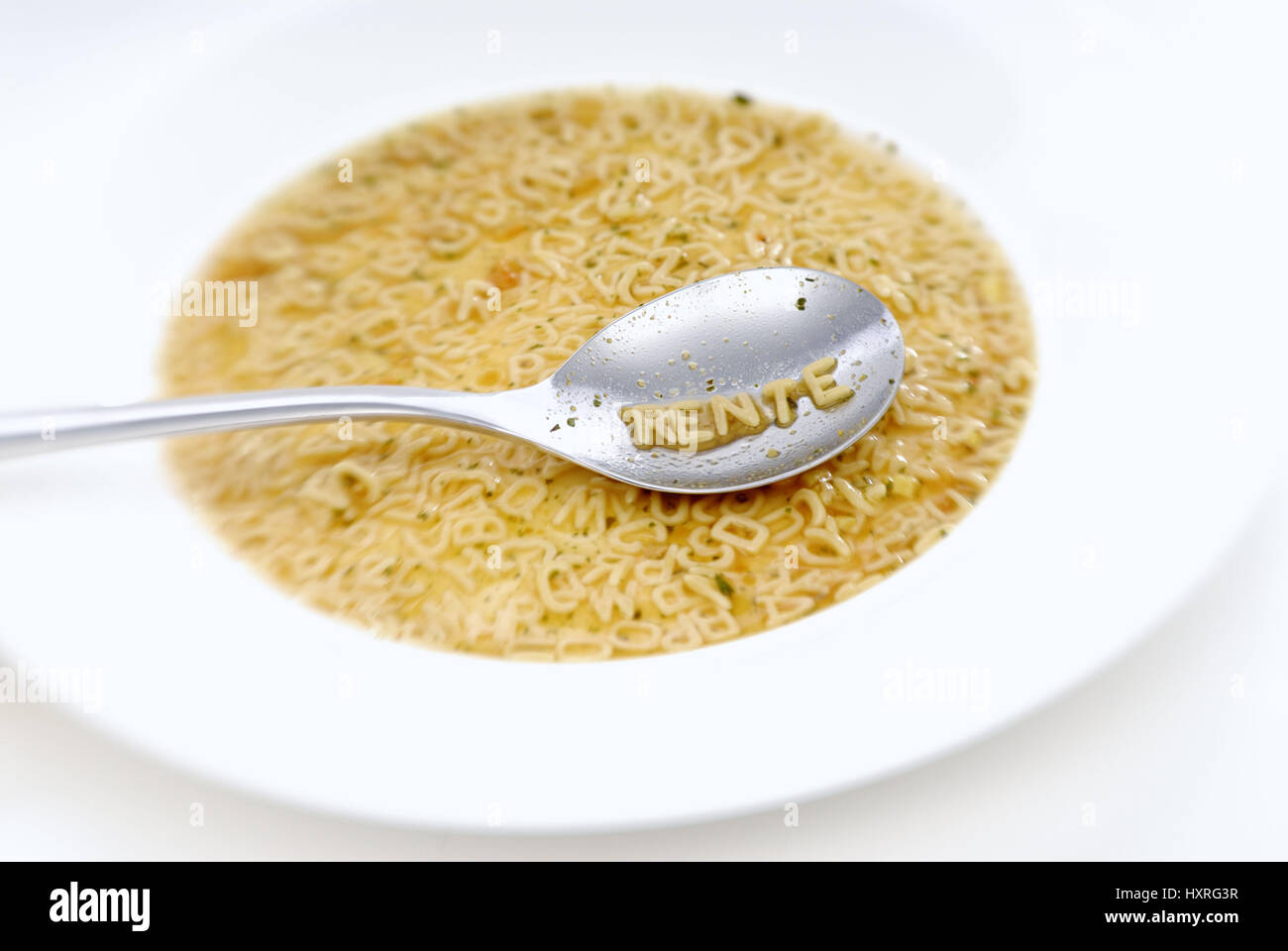 The word Pension with noodle letter on a spoon, Das Wort Rente mit Nudelbuchstaben auf einem Löffel Stock Photo