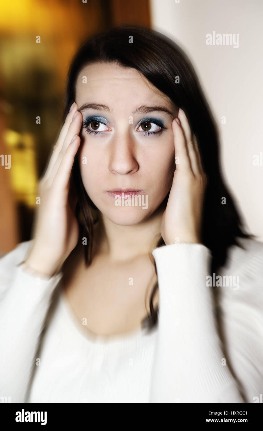 Young woman has headaches, Junge Frau hat Kopfschmerzen Stock Photo