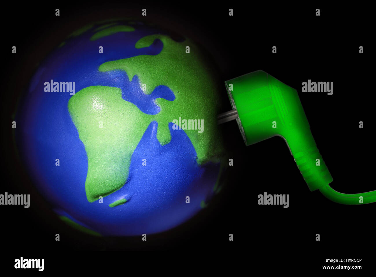 Globe with green plug, ecological stream, lastingness, Erdkugel mit grünem Stecker, Ökostrom, Nachhaltigkeit Stock Photo
