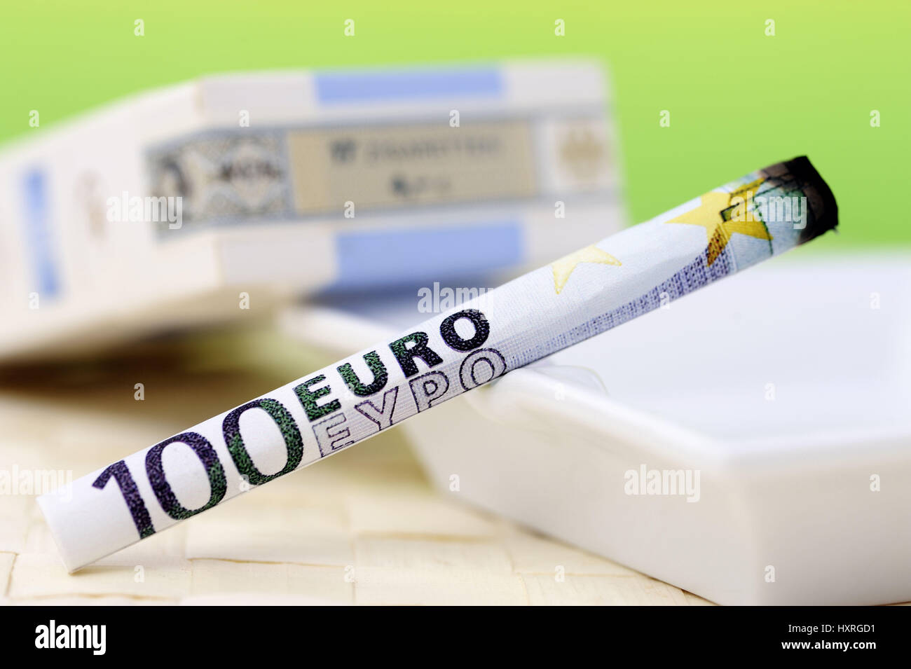 Cigarette from 100-euro-light, symbolic photo tobacco tax, Zigarette aus 100-Euro-Schein, Symbolfoto Tabaksteuer Stock Photo